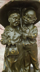 Bronze Elderly Couple Sculpture – Holding Umbrella