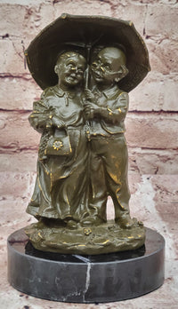 Bronze Elderly Couple Sculpture – Holding Umbrella