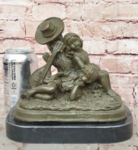 Bronze Children Resting Sculpture – Boy and Girl with Guitar