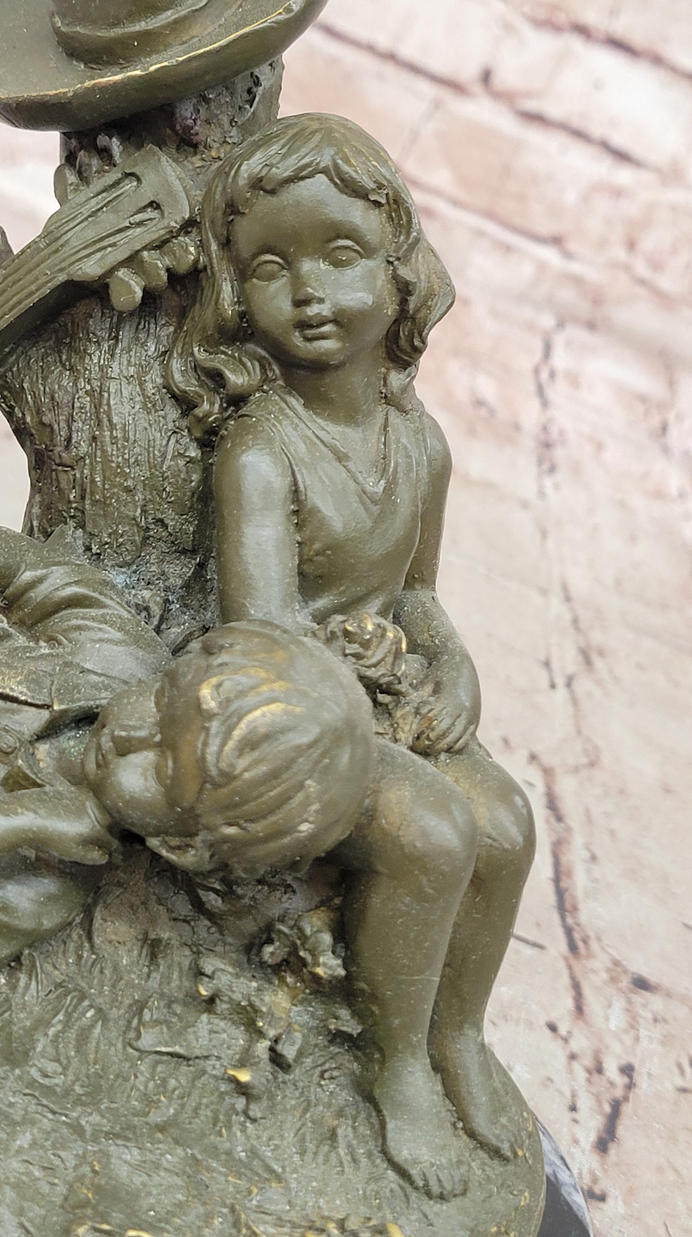 Bronze Children Resting Sculpture – Boy and Girl with Guitar