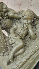 Bronze Children Resting Sculpture – Boy and Girl with Guitar