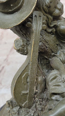 Bronze Children Resting Sculpture – Boy and Girl with Guitar