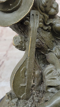 Bronze Children Resting Sculpture – Boy and Girl with Guitar