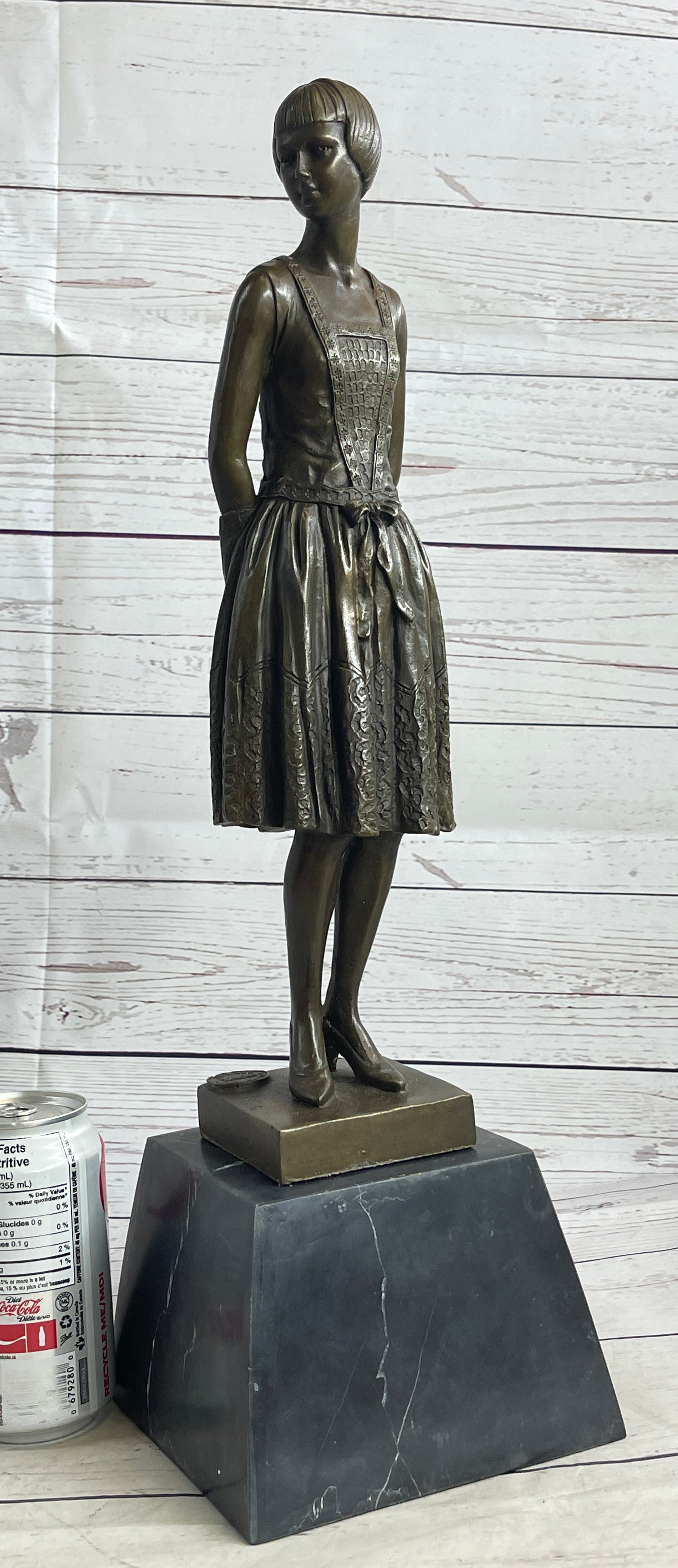 Young Woman in Dress With Short Hair Bronze Sculpture on Marble