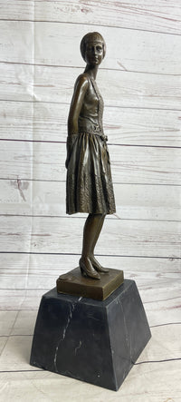 Young Woman in Dress With Short Hair Bronze Sculpture on Marble