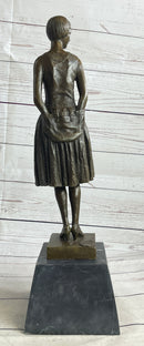 Young Woman in Dress With Short Hair Bronze Sculpture on Marble