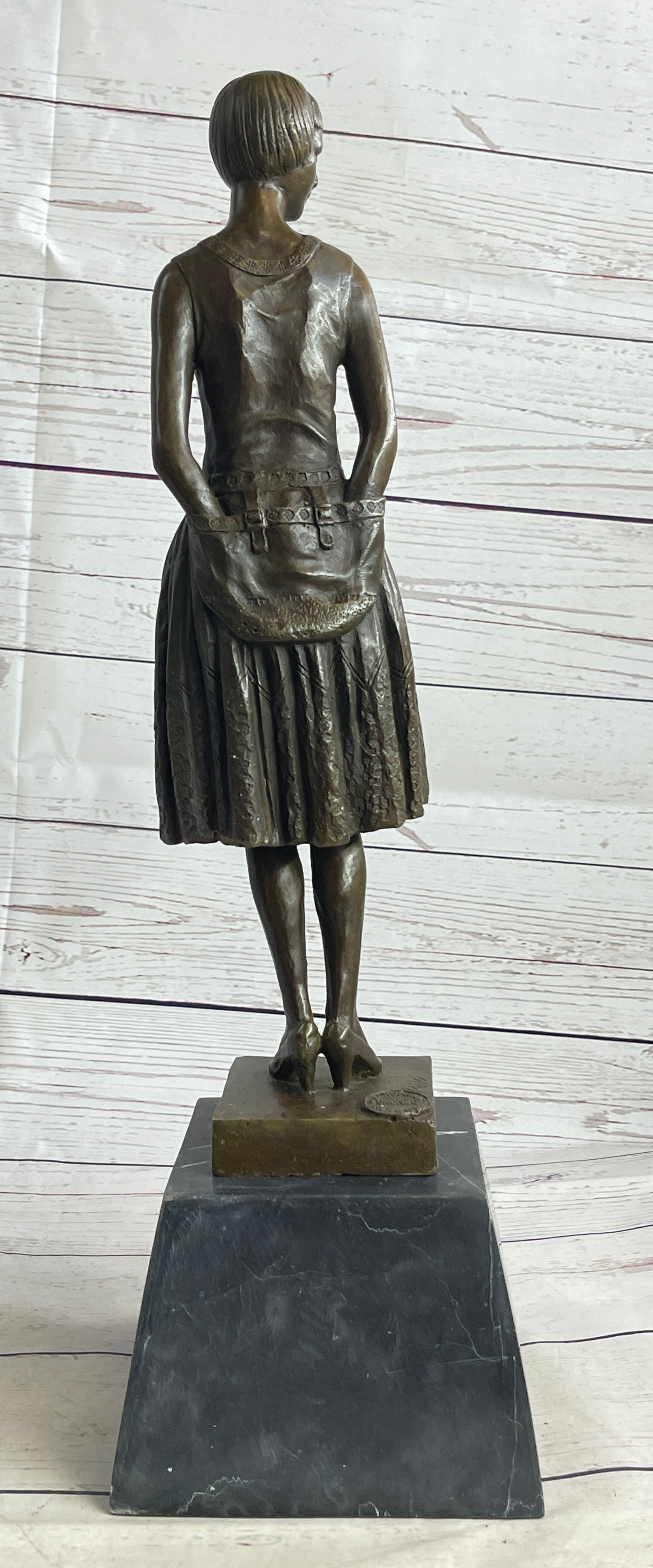 Young Woman in Dress With Short Hair Bronze Sculpture on Marble