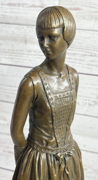 Young Woman in Dress With Short Hair Bronze Sculpture on Marble
