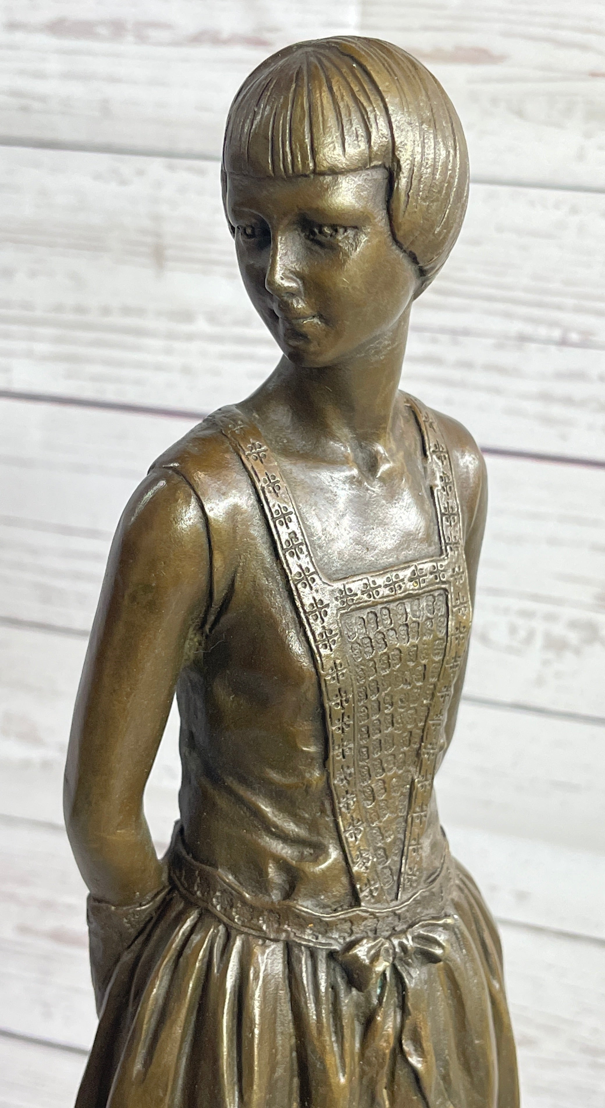 Young Woman in Dress With Short Hair Bronze Sculpture on Marble