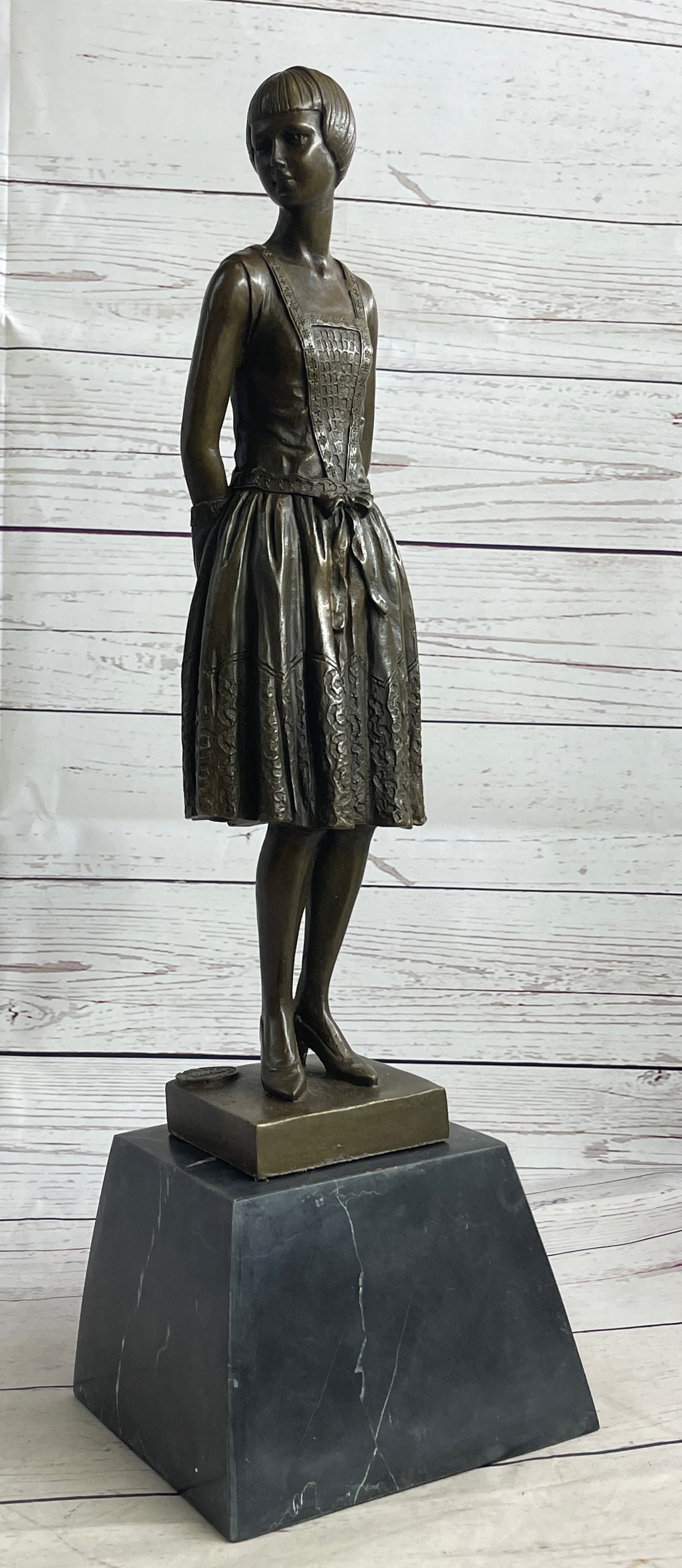 Young Woman in Dress With Short Hair Bronze Sculpture on Marble