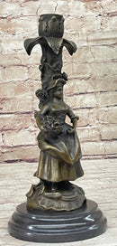 Young Woman Holding Basket of Flowers - Bronze Candle Holder