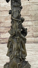 Young Woman Holding Basket of Flowers - Bronze Candle Holder