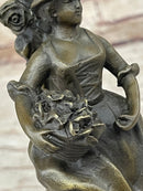 Young Woman Holding Basket of Flowers - Bronze Candle Holder