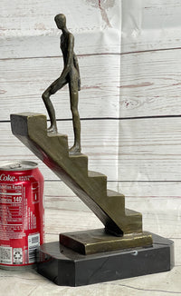 Abstract Bronze Sculpture of Man Climbing Stairs by Mario Nick