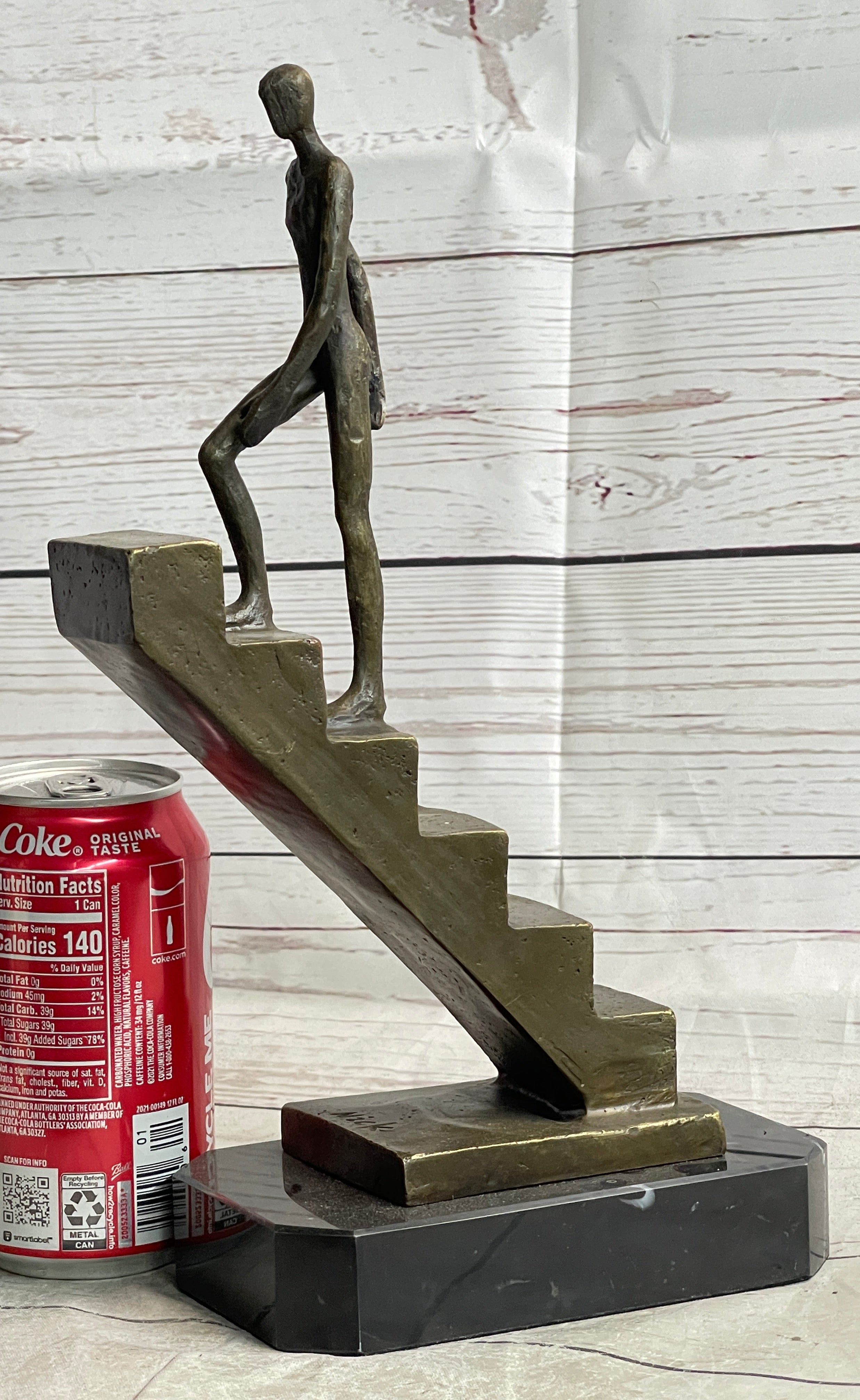 Abstract Bronze Sculpture of Man Climbing Stairs by Mario Nick