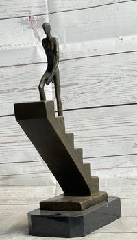 Abstract Bronze Sculpture of Man Climbing Stairs by Mario Nick