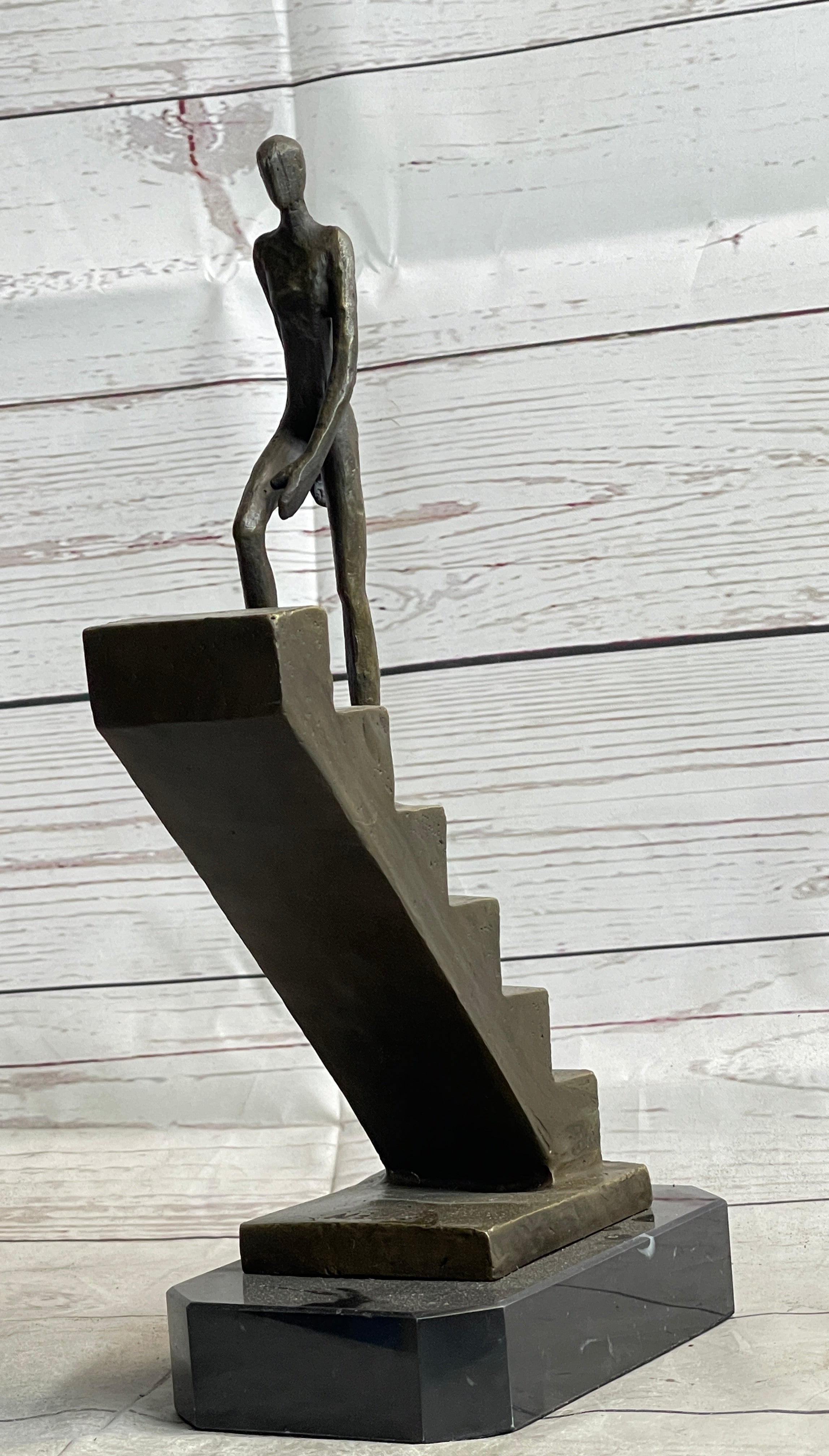 Abstract Bronze Sculpture of Man Climbing Stairs by Mario Nick