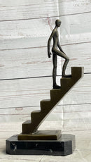 Abstract Bronze Sculpture of Man Climbing Stairs by Mario Nick