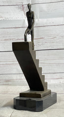 Abstract Bronze Sculpture of Man Climbing Stairs by Mario Nick