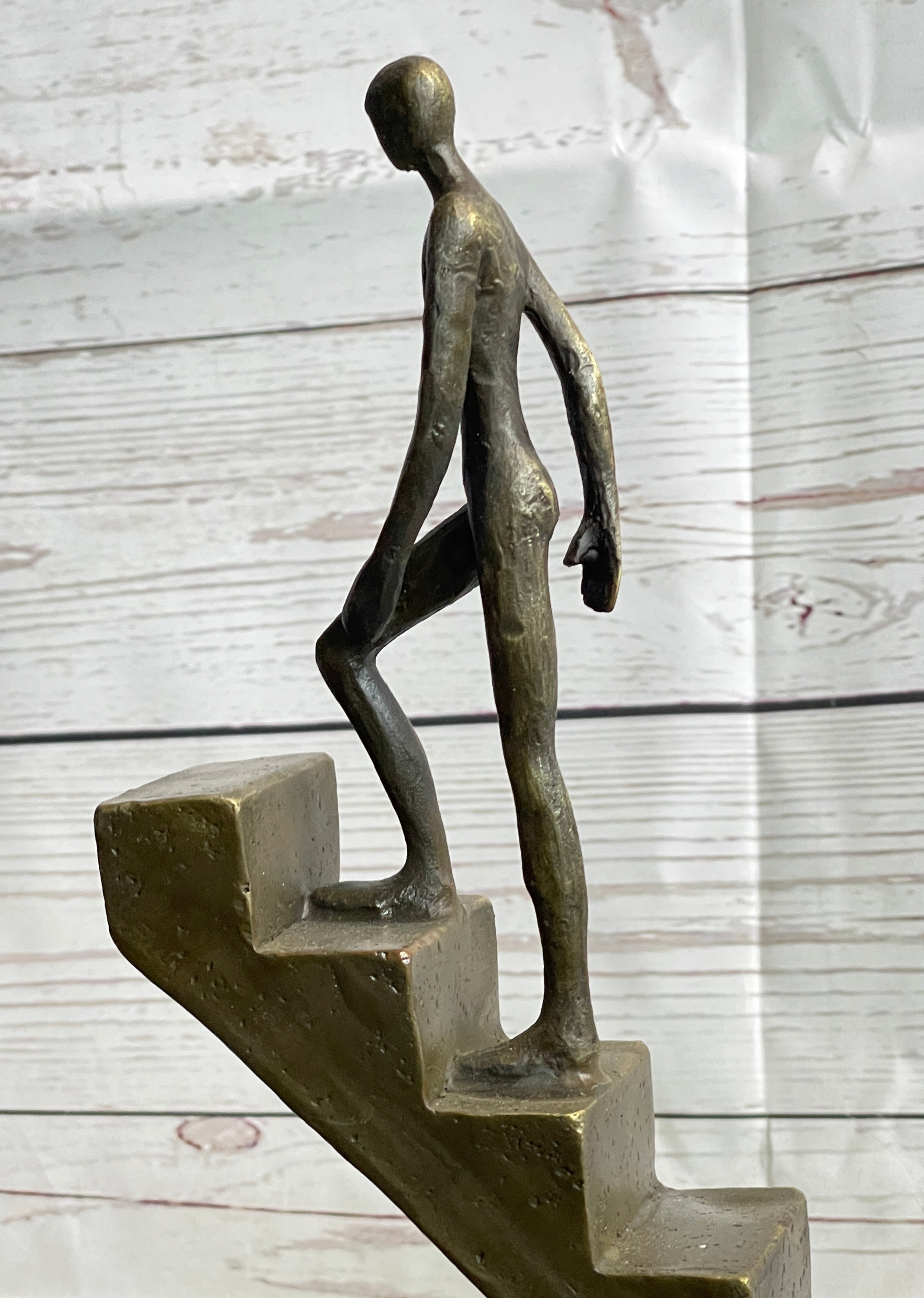 Abstract Bronze Sculpture of Man Climbing Stairs by Mario Nick