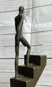 Abstract Bronze Sculpture of Man Climbing Stairs by Mario Nick