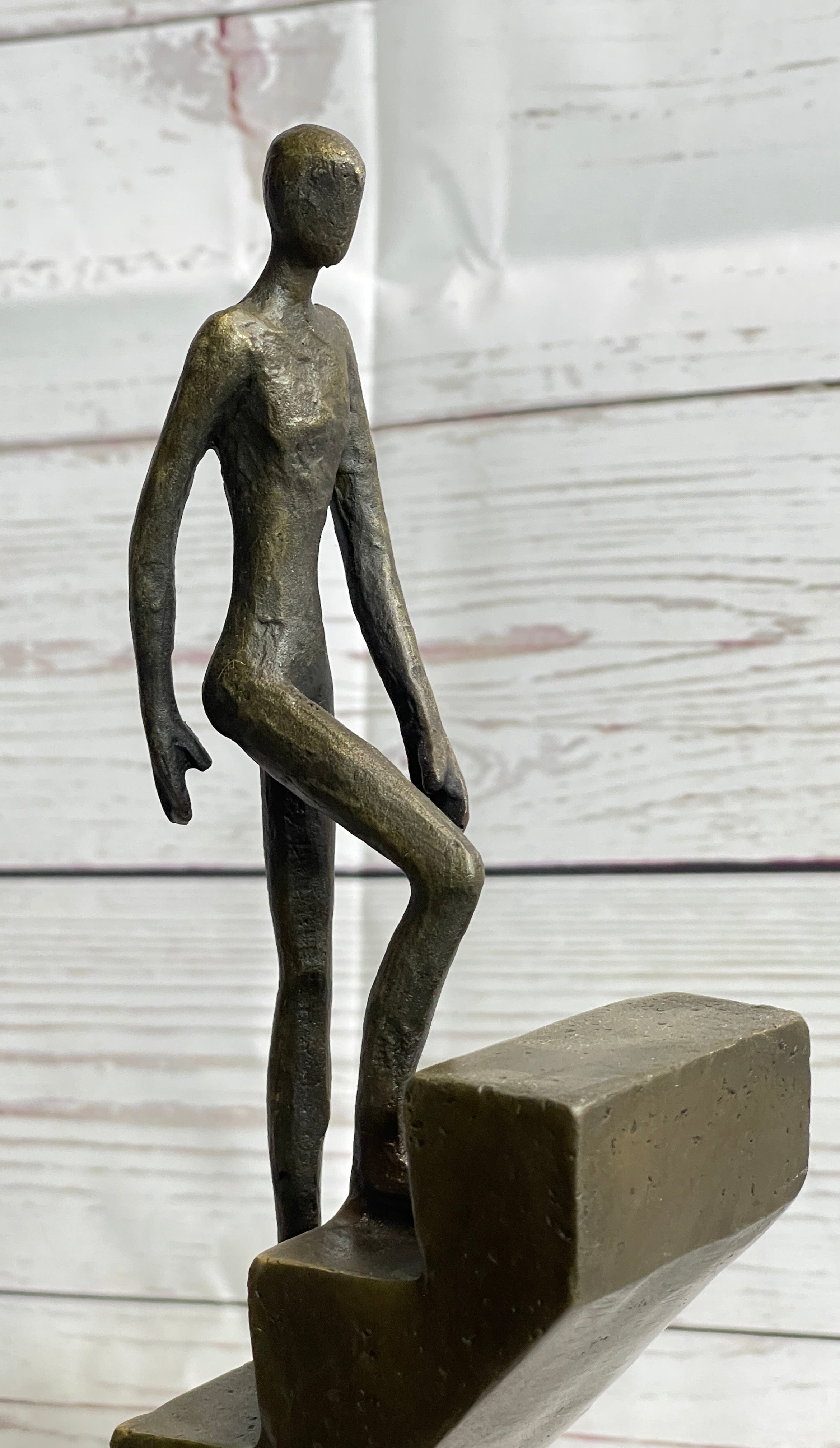 Abstract Bronze Sculpture of Man Climbing Stairs by Mario Nick
