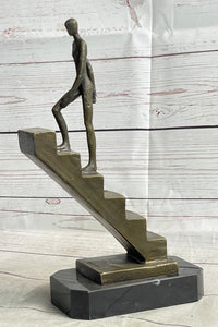 Abstract Bronze Sculpture of Man Climbing Stairs by Mario Nick