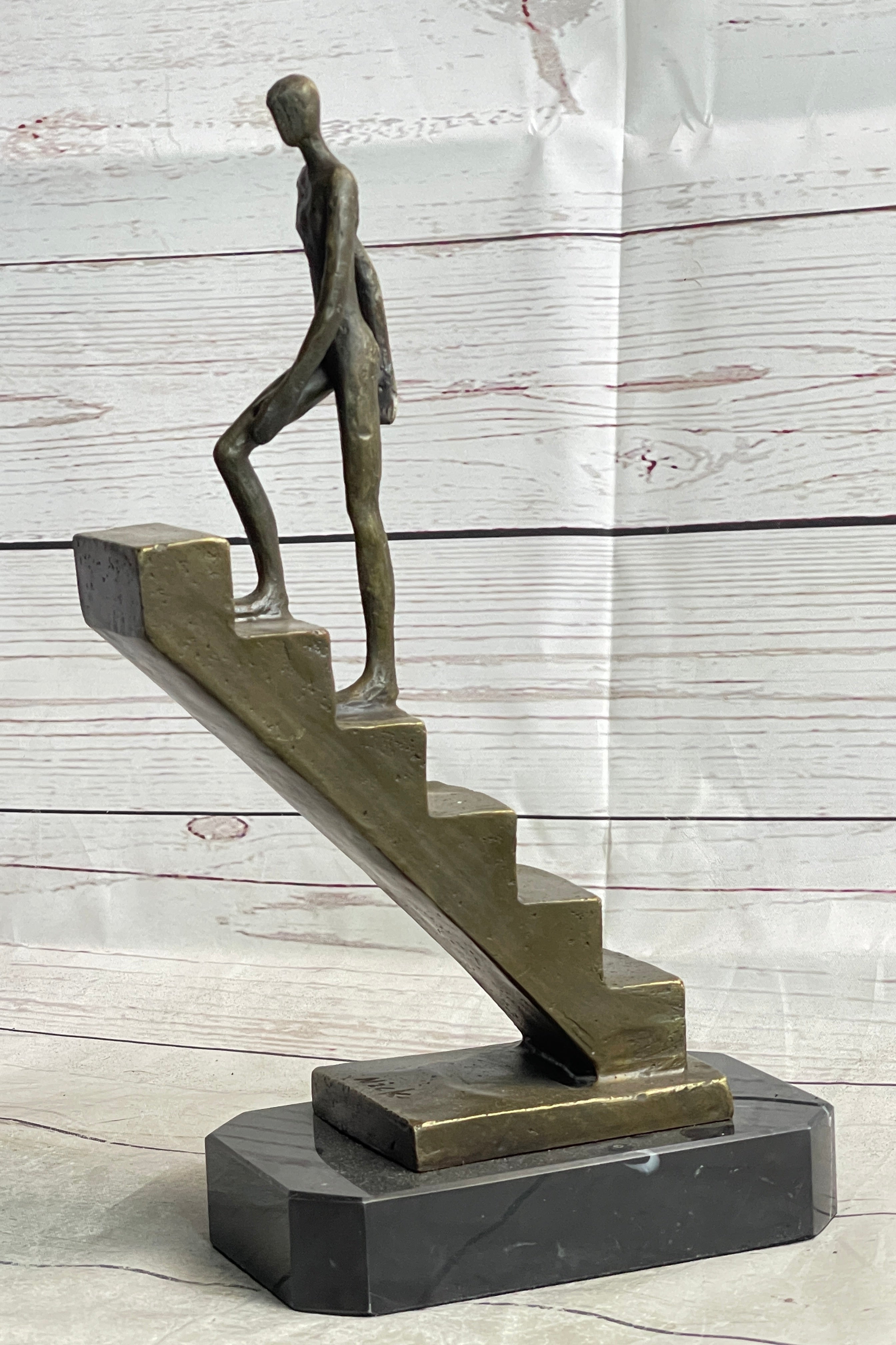 Abstract Bronze Sculpture of Man Climbing Stairs by Mario Nick