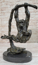 Playful Chimpanzee Swing on Bar Bronze by C. Williams