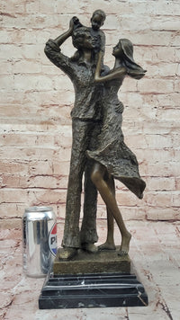 Bronze Family Sculpture – Joyful Moments with Parents and Child