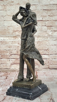 Bronze Family Sculpture – Joyful Moments with Parents and Child