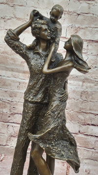 Bronze Family Sculpture – Joyful Moments with Parents and Child