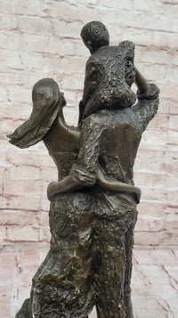 Bronze Family Sculpture – Joyful Moments with Parents and Child