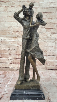 Bronze Family Sculpture – Joyful Moments with Parents and Child