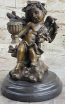Cherub Holding Celebration Cup 8.5'' Bronze Candleholder