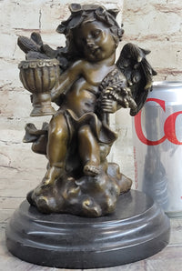 Cherub Holding Celebration Cup 8.5'' Bronze Candleholder