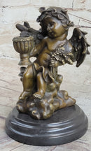 Cherub Holding Celebration Cup 8.5'' Bronze Candleholder