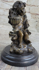 Cherub Holding Celebration Cup 8.5'' Bronze Candleholder