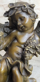 Cherub Holding Celebration Cup 8.5'' Bronze Candleholder