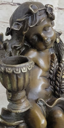 Cherub Holding Celebration Cup 8.5'' Bronze Candleholder