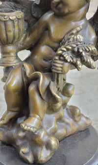 Cherub Holding Celebration Cup 8.5'' Bronze Candleholder
