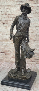 Cowboy Holding Horse Saddle - Western Art Bronze Sculpture