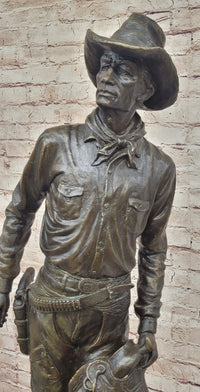 Cowboy Holding Horse Saddle - Western Art Bronze Sculpture