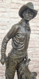 Cowboy Holding Horse Saddle - Western Art Bronze Sculpture