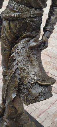 Cowboy Holding Horse Saddle - Western Art Bronze Sculpture