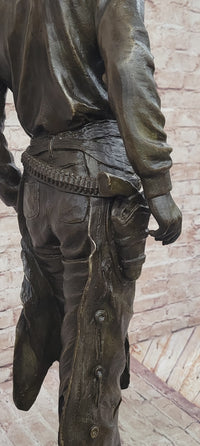 Cowboy Holding Horse Saddle - Western Art Bronze Sculpture