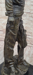 Cowboy Holding Horse Saddle - Western Art Bronze Sculpture