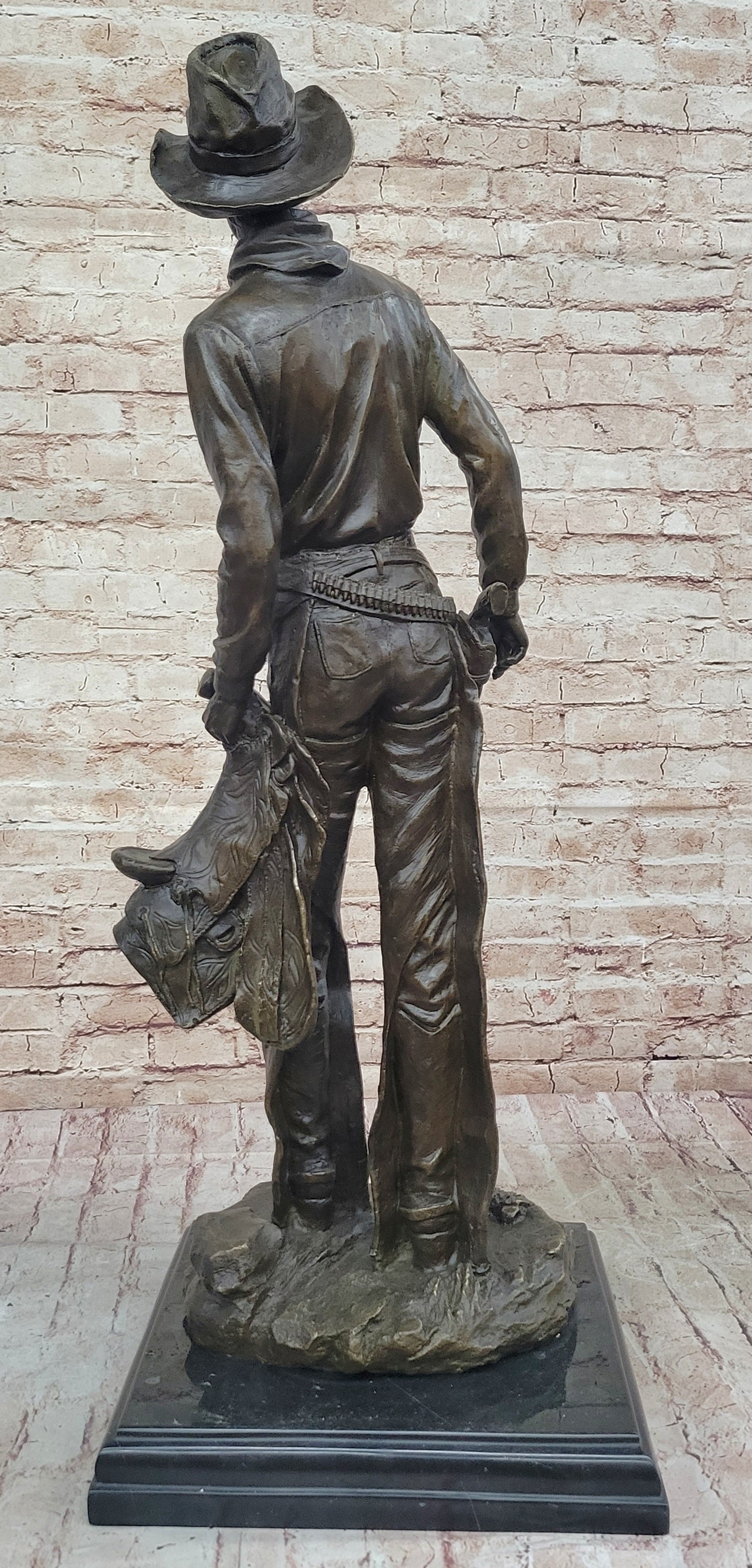Cowboy Holding Horse Saddle - Western Art Bronze Sculpture