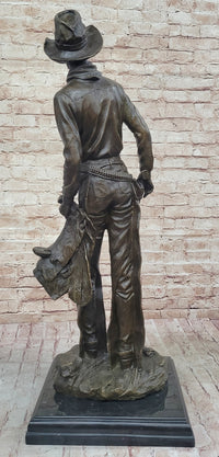 Cowboy Holding Horse Saddle - Western Art Bronze Sculpture