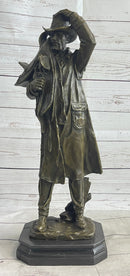 Country Western Cowboy Hauling Saddle Bronze Sculpture